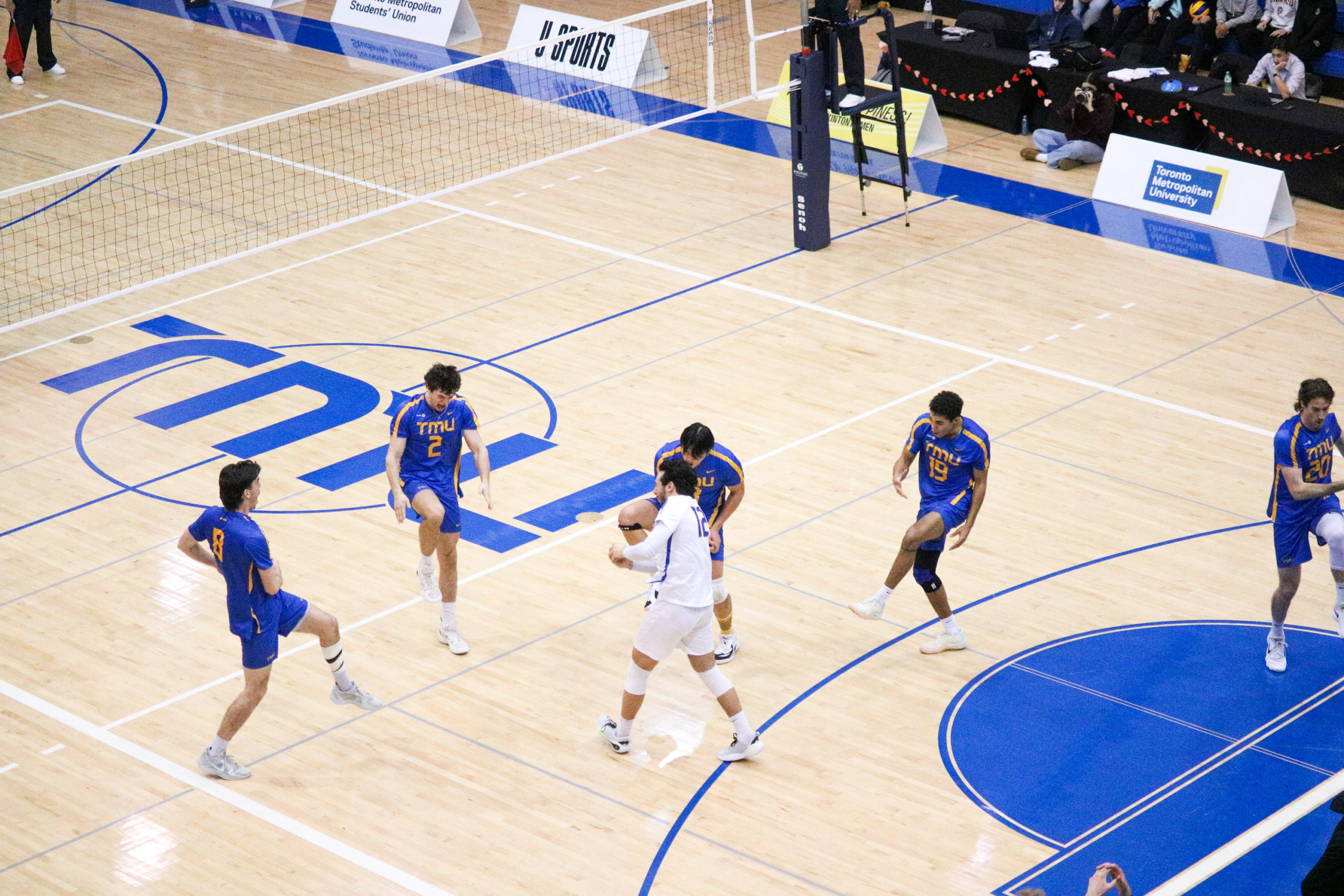 The TMU Bold doing their iconic "BOOM" celebration slide 6