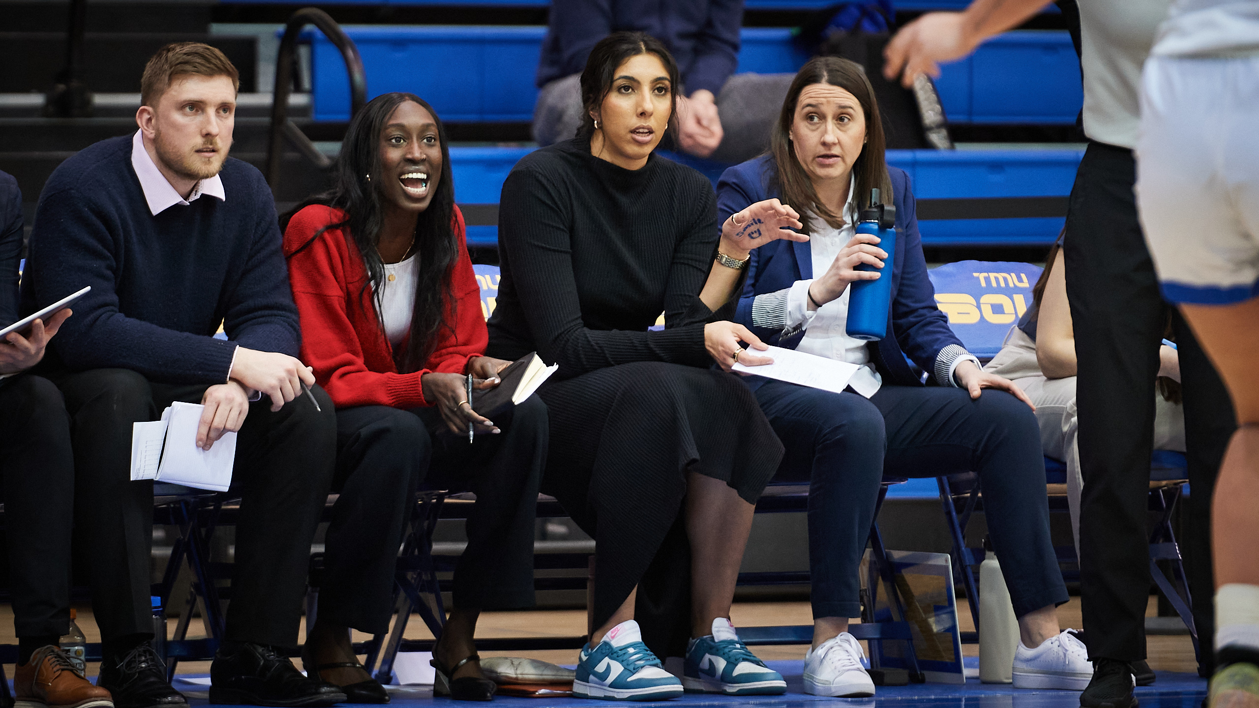 The bench of coaches and assistant coaches of the TMU Bold women's basketball team from 2024