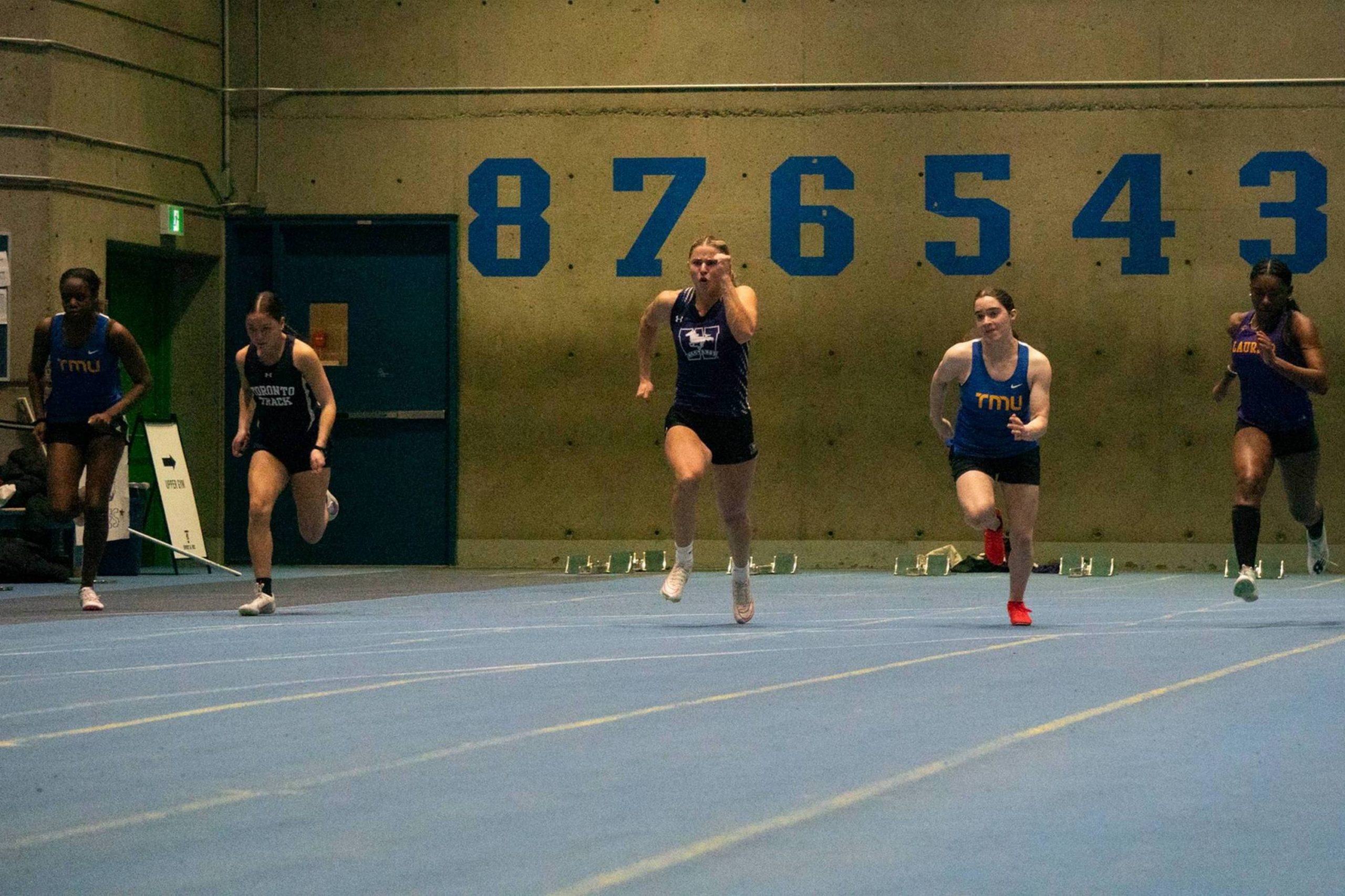 A bunch of athletes from the TMU Bold track and field team competing