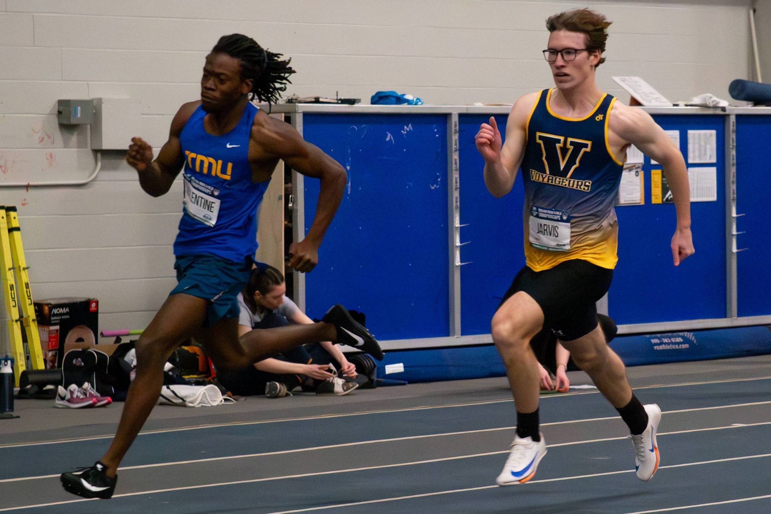 Neon Valentine running in a track and field meet